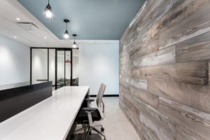 A gorgeous office designed with bright lighting and beautiful wood walls